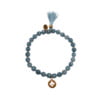 Bracelet MAELYSSE en pierres naturelles bleues avec un pompon et une pampille